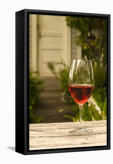 USA, Washington, Prosser. A glass of red wine on a picnic table outside of eastern Washington-Richard Duval-Framed Premier Image Canvas