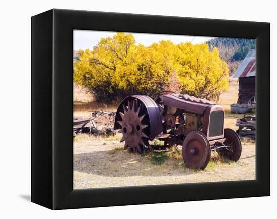 USA, Washington State, Molson, Okanogan County. Rusty old tractor in the historic ghost town.-Julie Eggers-Framed Premier Image Canvas