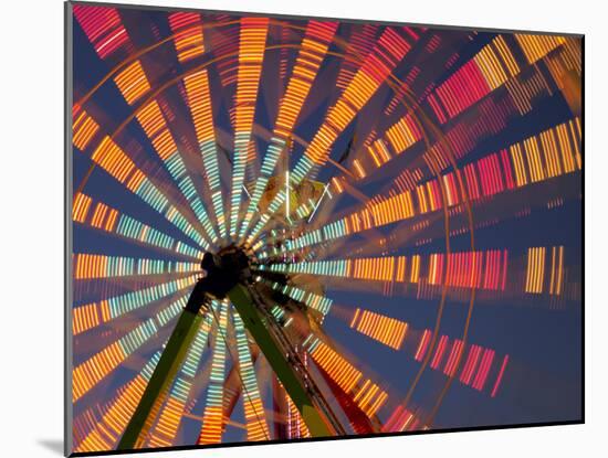 USA, Washington State, Puyallup, ferris wheel in motion at annual Puyallup Fair at night.-Merrill Images-Mounted Photographic Print