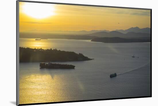 USA, Washington State, Seattle. A Washington State ferry crosses Puget Sound at sunset.-Merrill Images-Mounted Photographic Print