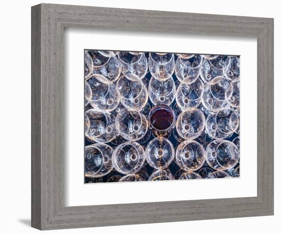 USA, Washington State, Seattle. One glass of red wine in a row of wine glasses.-Richard Duval-Framed Photographic Print