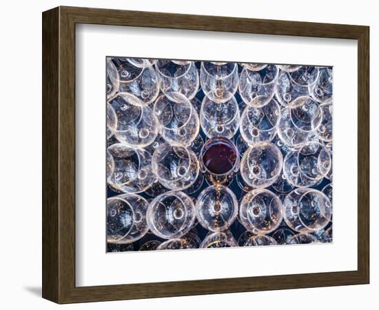 USA, Washington State, Seattle. One glass of red wine in a row of wine glasses.-Richard Duval-Framed Photographic Print