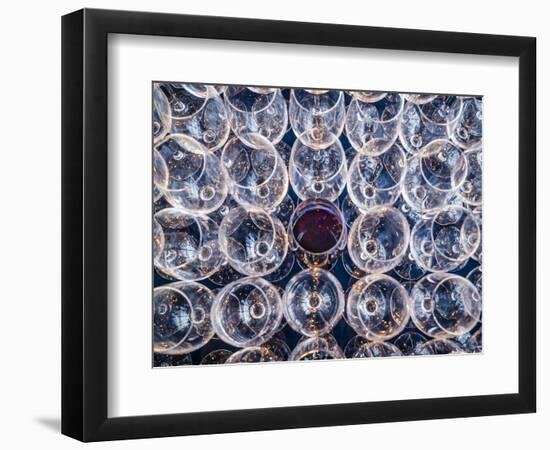 USA, Washington State, Seattle. One glass of red wine in a row of wine glasses.-Richard Duval-Framed Photographic Print