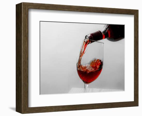 USA, Washington State, Seattle. Red wine pours into a glass.-Richard Duval-Framed Photographic Print