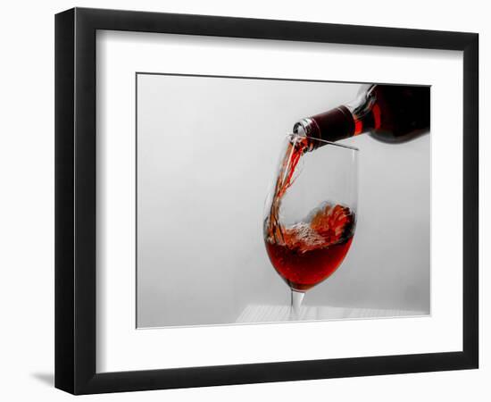 USA, Washington State, Seattle. Red wine pours into a glass.-Richard Duval-Framed Photographic Print