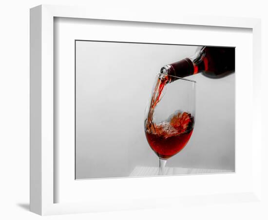 USA, Washington State, Seattle. Red wine pours into a glass.-Richard Duval-Framed Photographic Print