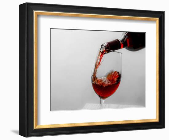 USA, Washington State, Seattle. Red wine pours into a glass.-Richard Duval-Framed Photographic Print