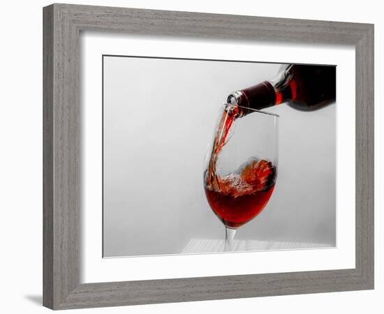 USA, Washington State, Seattle. Red wine pours into a glass.-Richard Duval-Framed Photographic Print