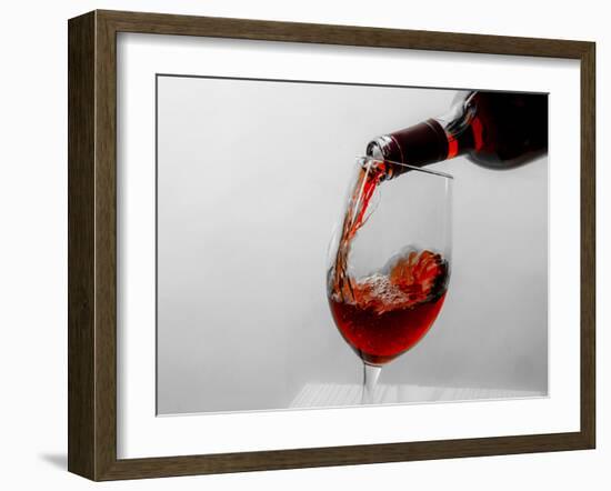 USA, Washington State, Seattle. Red wine pours into a glass.-Richard Duval-Framed Photographic Print