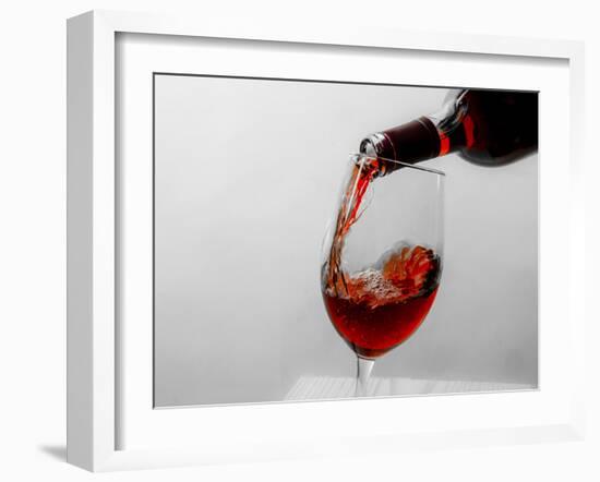 USA, Washington State, Seattle. Red wine pours into a glass.-Richard Duval-Framed Photographic Print