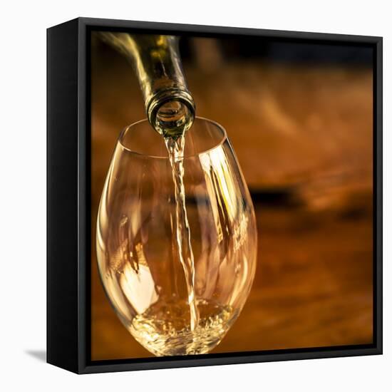 USA, Washington State, Seattle. White wine pouring into glass in a Seattle winery.-Richard Duval-Framed Premier Image Canvas