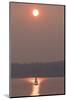 USA, Washington State. Two people in sailboat. Smoky skies from wildfires create eerie sunset-Trish Drury-Mounted Photographic Print
