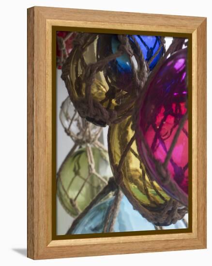 USA, Washington State, Whidbey Island, Coupeville. Colorful glass fishing net floats-Merrill Images-Framed Premier Image Canvas