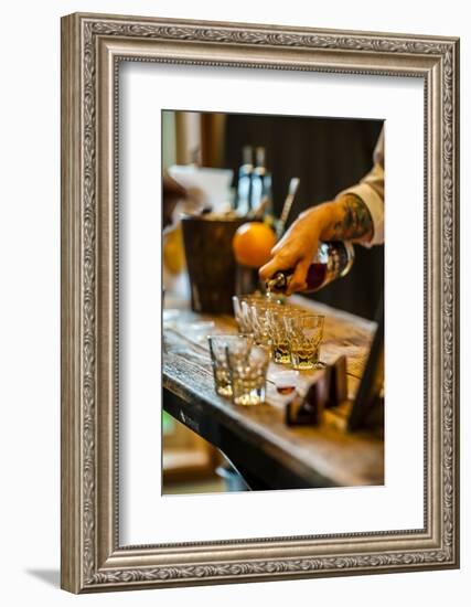 USA, Washington State, Woodinville. Bourbon whiskey pouring at a tasting room.-Richard Duval-Framed Photographic Print