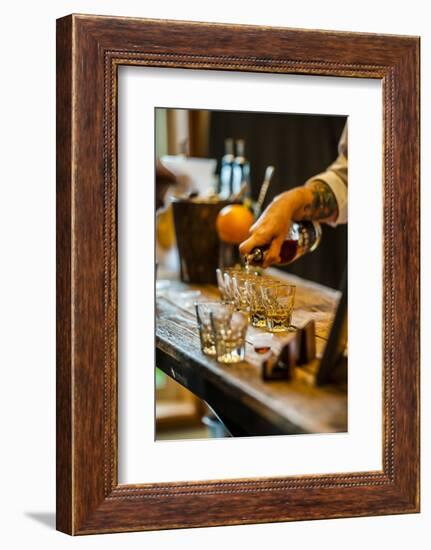 USA, Washington State, Woodinville. Bourbon whiskey pouring at a tasting room.-Richard Duval-Framed Photographic Print