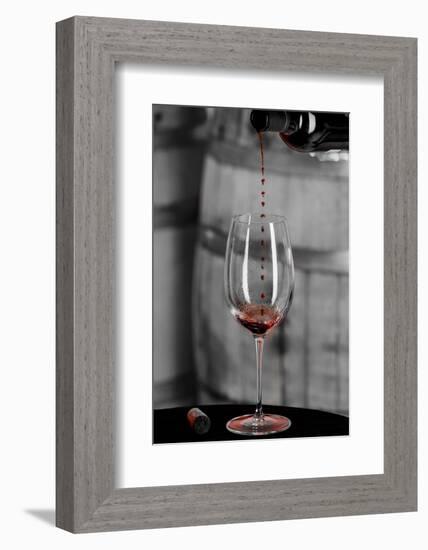 USA, Washington Woodinville. Red wine pouring into is captured in mid-air-Richard Duval-Framed Photographic Print