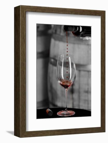 USA, Washington Woodinville. Red wine pouring into is captured in mid-air-Richard Duval-Framed Photographic Print