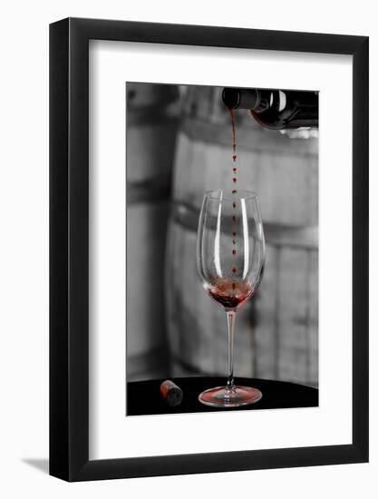 USA, Washington Woodinville. Red wine pouring into is captured in mid-air-Richard Duval-Framed Photographic Print