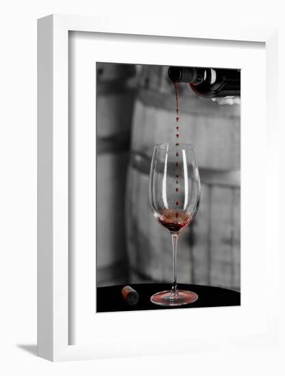 USA, Washington Woodinville. Red wine pouring into is captured in mid-air-Richard Duval-Framed Photographic Print