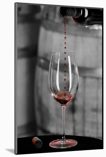 USA, Washington Woodinville. Red wine pouring into is captured in mid-air-Richard Duval-Mounted Photographic Print