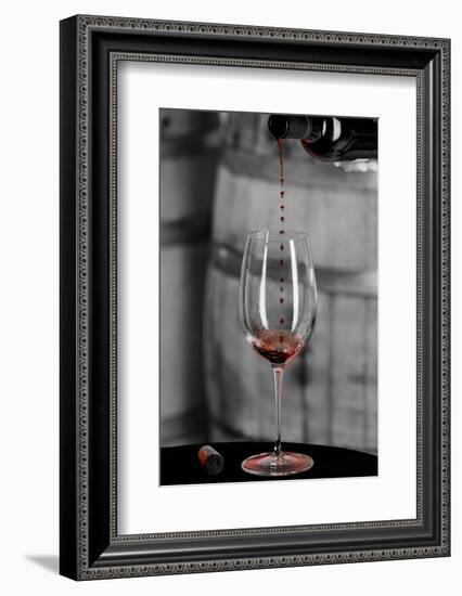 USA, Washington Woodinville. Red wine pouring into is captured in mid-air-Richard Duval-Framed Photographic Print