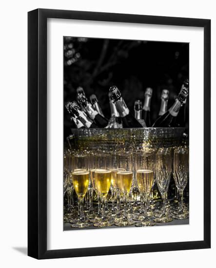 USA, Washington, Woodinville. Sparkling wine bottles and glasses ready for tasting at a wine event.-Richard Duval-Framed Photographic Print