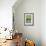 USA, Wyoming, male Yellow-headed Blackbird perches on dried cattails-Elizabeth Boehm-Framed Photographic Print displayed on a wall