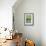 USA, Wyoming, male Yellow-headed Blackbird perches on dried cattails-Elizabeth Boehm-Framed Photographic Print displayed on a wall