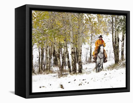 USA, Wyoming, Shell, Big Horn Mountains, Cowboys riding through with fresh snowfall-Terry Eggers-Framed Premier Image Canvas