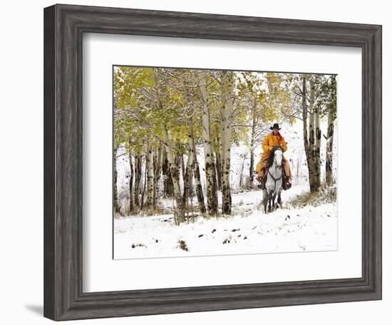 USA, Wyoming, Shell, Big Horn Mountains, Cowboys riding through with fresh snowfall-Terry Eggers-Framed Photographic Print