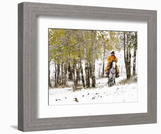 USA, Wyoming, Shell, Big Horn Mountains, Cowboys riding through with fresh snowfall-Terry Eggers-Framed Photographic Print