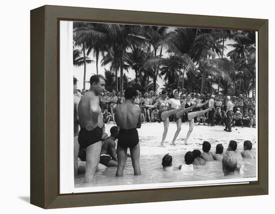 USO Chorus Girls Doing High-Kicks in Swimsuits During Impromptu Song and Dance on Beach-Peter Stackpole-Framed Premier Image Canvas