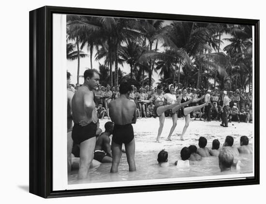 USO Chorus Girls Doing High-Kicks in Swimsuits During Impromptu Song and Dance on Beach-Peter Stackpole-Framed Premier Image Canvas