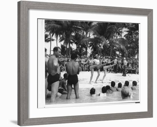 USO Chorus Girls Doing High-Kicks in Swimsuits During Impromptu Song and Dance on Beach-Peter Stackpole-Framed Premium Photographic Print