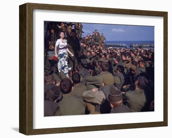 Uso Performer Entertaining a Crowd of Soldiers Aboard a Troop Transport Ship-Carl Mydans-Framed Photographic Print