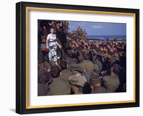 Uso Performer Entertaining a Crowd of Soldiers Aboard a Troop Transport Ship-Carl Mydans-Framed Photographic Print