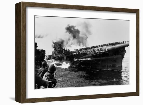 USS Franklin Aircraft Carrier on Fire and Listing after a Strike by a Japanese Dive Bomber-null-Framed Photo