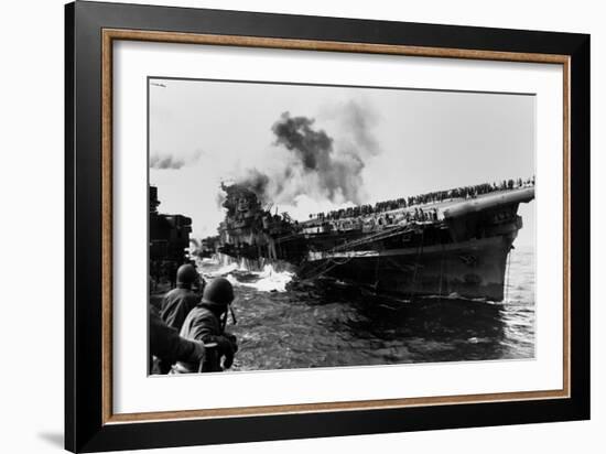 USS Franklin Aircraft Carrier on Fire and Listing after a Strike by a Japanese Dive Bomber-null-Framed Photo