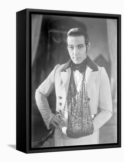 Valentino on the set of 'The Eagle' with his arm in a sling after a car accident, c.1925-null-Framed Premier Image Canvas