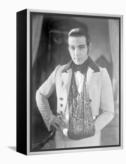 Valentino on the set of 'The Eagle' with his arm in a sling after a car accident, c.1925-null-Framed Premier Image Canvas