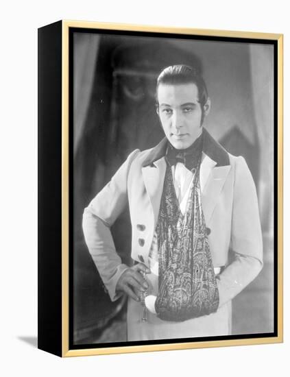 Valentino on the set of 'The Eagle' with his arm in a sling after a car accident, c.1925-null-Framed Premier Image Canvas