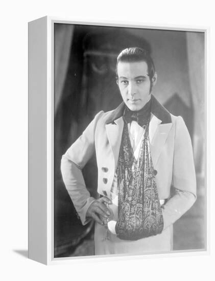 Valentino on the set of 'The Eagle' with his arm in a sling after a car accident, c.1925-null-Framed Premier Image Canvas