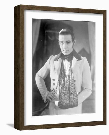 Valentino on the set of 'The Eagle' with his arm in a sling after a car accident, c.1925-null-Framed Photographic Print