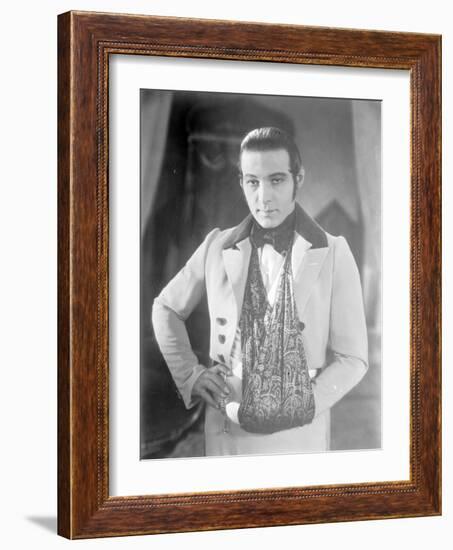 Valentino on the set of 'The Eagle' with his arm in a sling after a car accident, c.1925-null-Framed Photographic Print