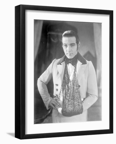 Valentino on the set of 'The Eagle' with his arm in a sling after a car accident, c.1925-null-Framed Photographic Print