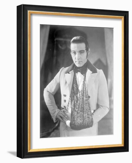 Valentino on the set of 'The Eagle' with his arm in a sling after a car accident, c.1925-null-Framed Photographic Print