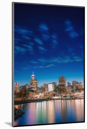 Vancouver skyline and high rise buildings at night, Vancouver, British Columbia, Canada, North Amer-Toms Auzins-Mounted Photographic Print