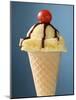 Vanilla Ice Cream Cone with Chocolate Sauce and Cocktail Cherry-null-Mounted Photographic Print