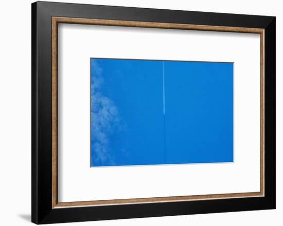 Vapor trail in sky over United Kingdom-null-Framed Photographic Print