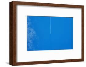 Vapor trail in sky over United Kingdom-null-Framed Photographic Print